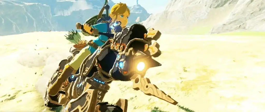 Link riding the Master Cycle Zero motorcycle across a grassy plain in Breath of the Wild