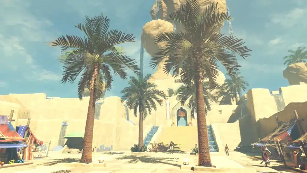 Gerudo Town square in Breath of the Wild with palm trees, market stalls and the stairs up to the chief's palace