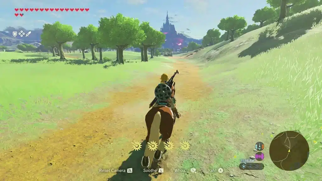 Link riding a horse along a dirt path toward Hyrule Castle in Breath of the Wild