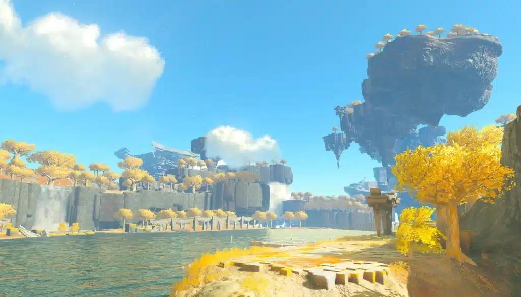A wide lake on the Great Sky Island with golden trees, stone ruins and floating islands overhead
