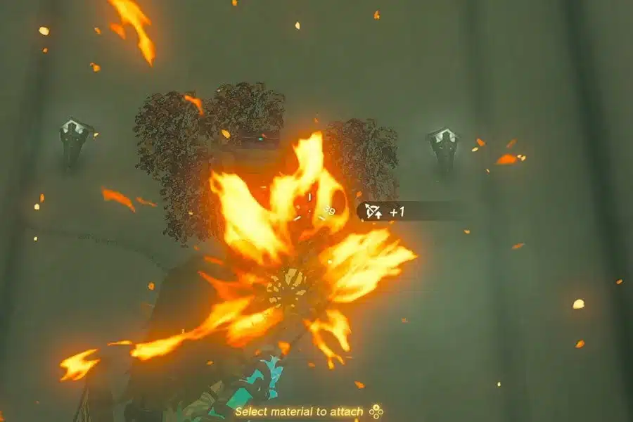 Link firing a Fire Fruit arrow at dry leaves wrapped around a chest on the wall inside In-isa Shrine