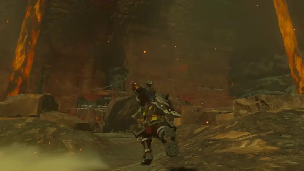 Link in Flamebreaker armor walking through a scorching lava lit cavern in Tears of the Kingdom